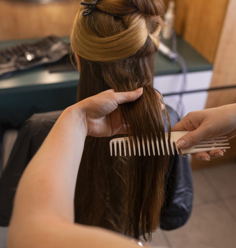 female-client-getting-her-hair-done-hairdresser