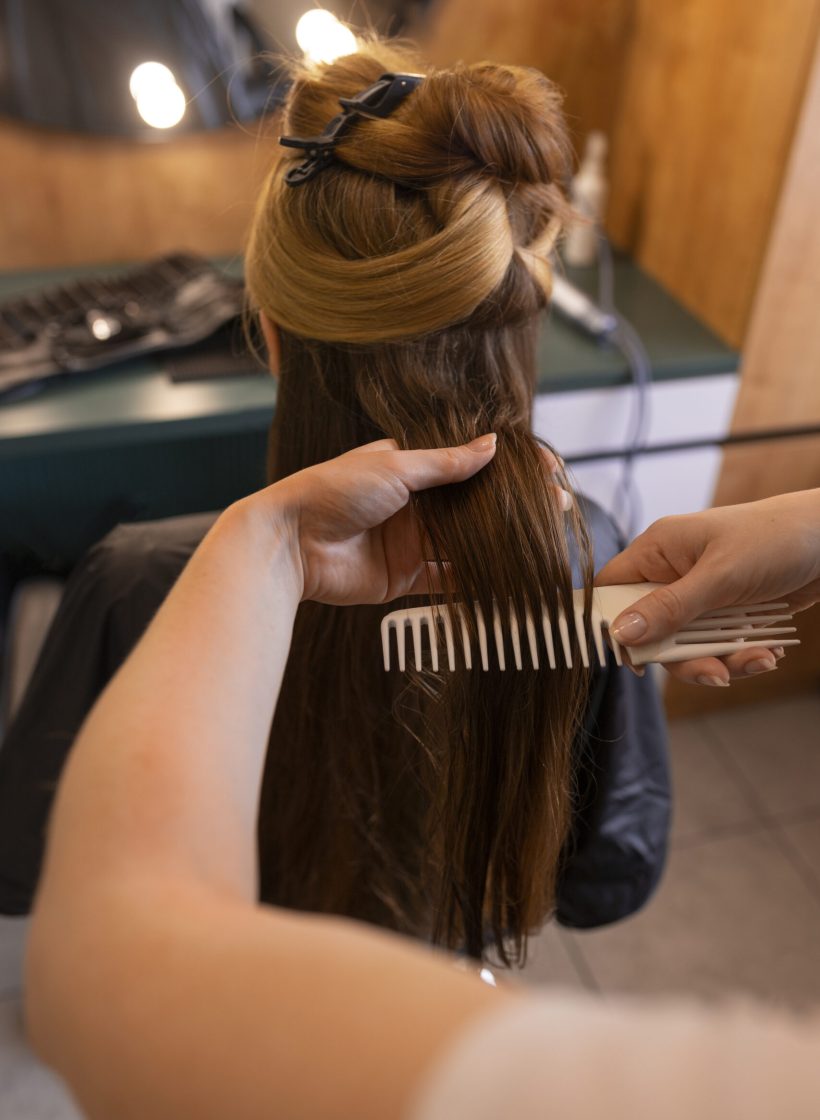 female-client-getting-her-hair-done-hairdresser